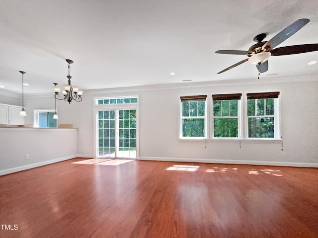 148 Daneborg Rd, Durham, NC 27703 - unfurnished living room featuring ornamental molding, a chandelier, healthy amount of natural light, baseboards, and recessed lighting