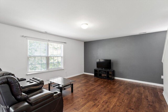 228 Botanical Ct, Bunnlevel, NC 28323 - living area featuring wood finished floors and baseboards