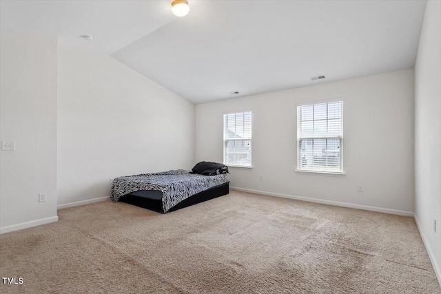 228 Botanical Ct, Bunnlevel, NC 28323 - carpeted bedroom featuring lofted ceiling and baseboards