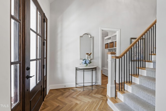 911 Canterbury Rd, Raleigh, NC 27607 - entrance foyer featuring baseboards, stairway, and a high ceiling