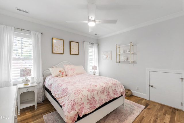 911 Canterbury Rd, Raleigh, NC 27607 - bedroom featuring multiple windows, light wood-style floors, a ceiling fan, and ornamental molding