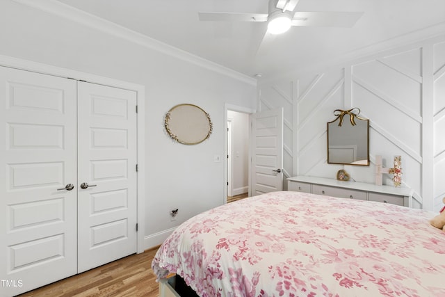 911 Canterbury Rd, Raleigh, NC 27607 - bedroom featuring light wood finished floors, a closet, ornamental molding, ceiling fan, and baseboards
