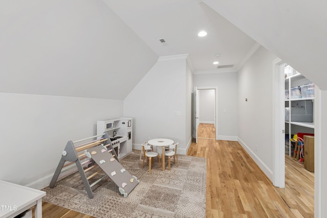 911 Canterbury Rd, Raleigh, NC 27607 - rec room with light wood finished floors, ornamental molding, baseboards, recessed lighting, and vaulted ceiling