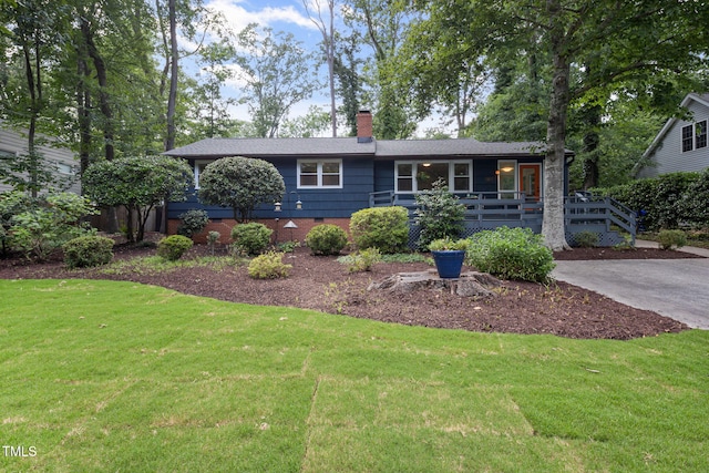 418 Ridgefield Rd, Chapel Hill, NC 27517 - view of front of home with a front yard, a chimney, and a porch