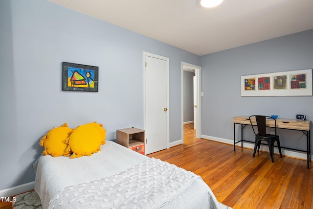 418 Ridgefield Rd, Chapel Hill, NC 27517 - bedroom with baseboards and wood finished floors