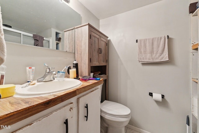 8089 Crawford Currin Rd, Oxford, NC 27565 - bathroom with vanity, toilet, a shower with curtain, and baseboards