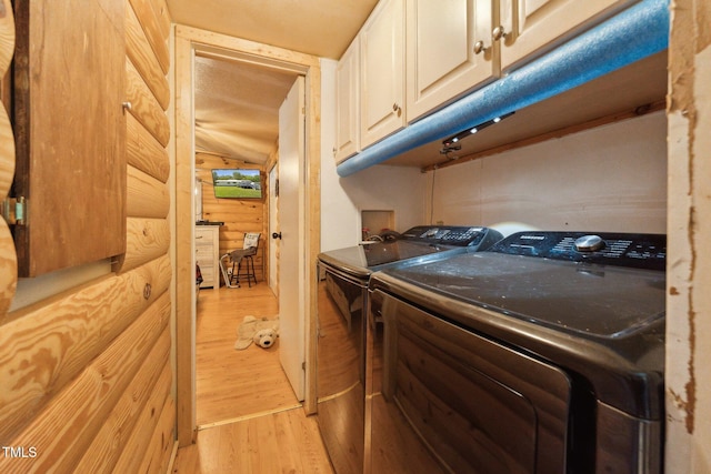 8089 Crawford Currin Rd, Oxford, NC 27565 - washroom featuring cabinet space, separate washer and dryer, and light wood-style floors