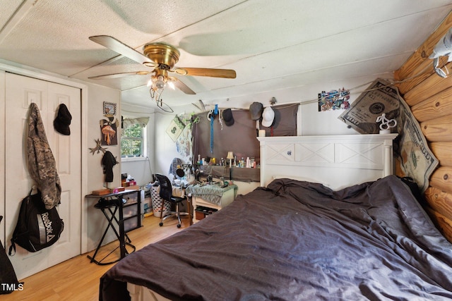 8089 Crawford Currin Rd, Oxford, NC 27565 - bedroom with wood finished floors, a ceiling fan, and a closet