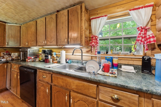 8089 Crawford Currin Rd, Oxford, NC 27565 - kitchen with black dishwasher, brown cabinets, a sink, and light wood-style flooring