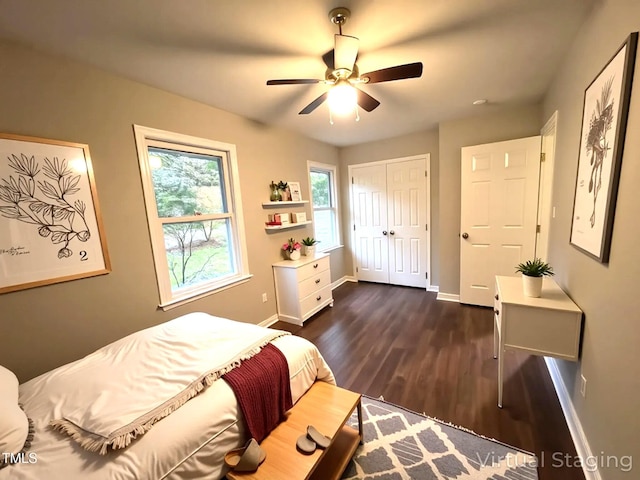 108 W Marsha Gayle Ct, Fuquay Varina, NC 27526 - bedroom with baseboards, dark wood-type flooring, a closet, and a ceiling fan