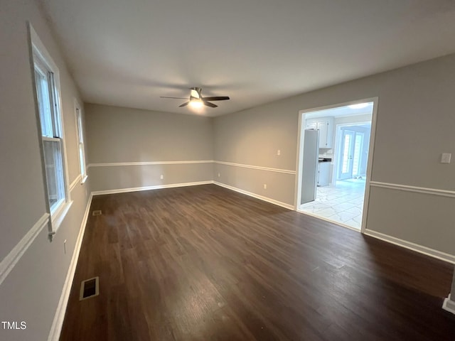 108 W Marsha Gayle Ct, Fuquay Varina, NC 27526 - empty room featuring dark wood-style flooring, a ceiling fan, and baseboards