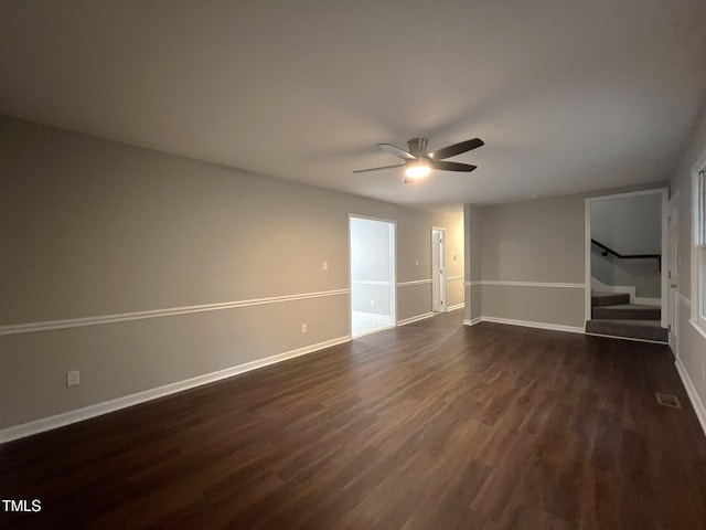 108 W Marsha Gayle Ct, Fuquay Varina, NC 27526 - empty room with dark wood-type flooring, a ceiling fan, stairway, and baseboards