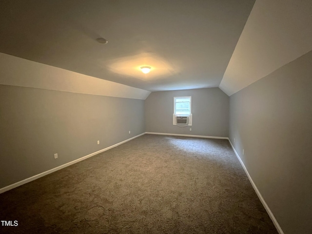 108 W Marsha Gayle Ct, Fuquay Varina, NC 27526 - bonus room with dark carpet, vaulted ceiling, baseboards, and cooling unit