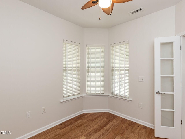 207 Callum Pl, Cary, NC 27519 - empty room featuring ceiling fan, wood finished floors, and baseboards
