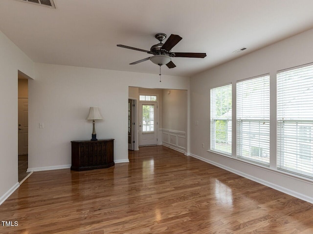 207 Callum Pl, Cary, NC 27519 - spare room featuring a ceiling fan, wood finished floors, and baseboards