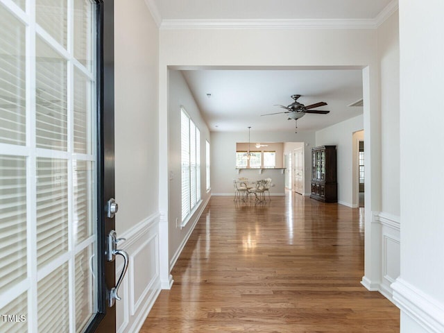 207 Callum Pl, Cary, NC 27519 - entrance foyer with light wood finished floors, a ceiling fan, and ornamental molding
