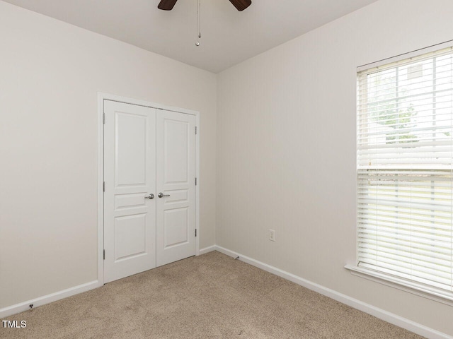 207 Callum Pl, Cary, NC 27519 - unfurnished bedroom with carpet floors, baseboards, a closet, and ceiling fan