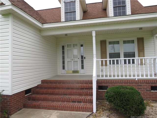 103 Autumn Chase Blvd, Lumberton, NC 28358 - doorway to property featuring a shingled roof, crawl space, and covered porch