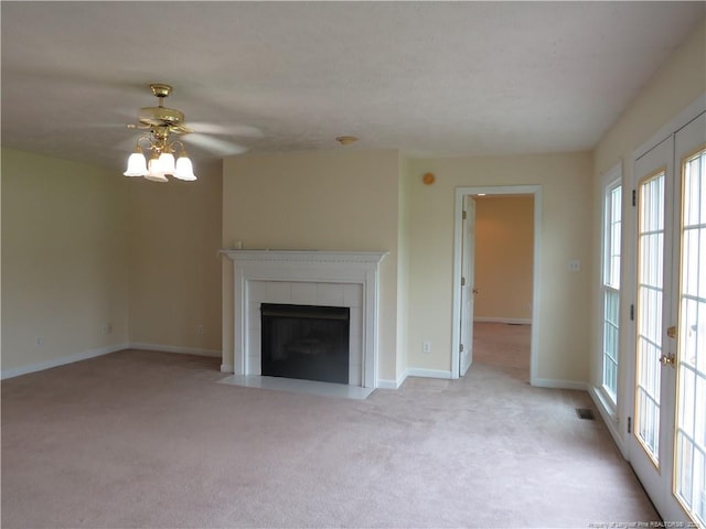 103 Autumn Chase Blvd, Lumberton, NC 28358 - unfurnished living room featuring light carpet, a ceiling fan, a tiled fireplace, and baseboards