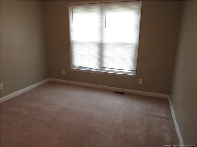103 Autumn Chase Blvd, Lumberton, NC 28358 - spare room featuring baseboards and light colored carpet