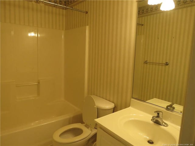 103 Autumn Chase Blvd, Lumberton, NC 28358 - bathroom featuring wallpapered walls, toilet, vanity, and bathtub / shower combination