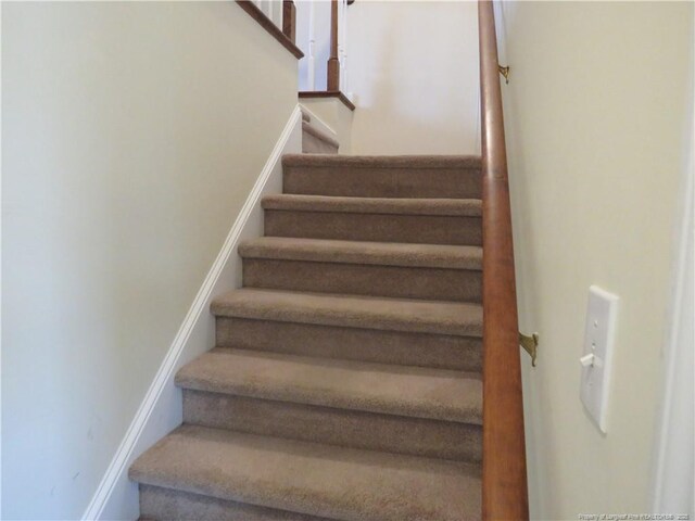 103 Autumn Chase Blvd, Lumberton, NC 28358 - staircase featuring baseboards