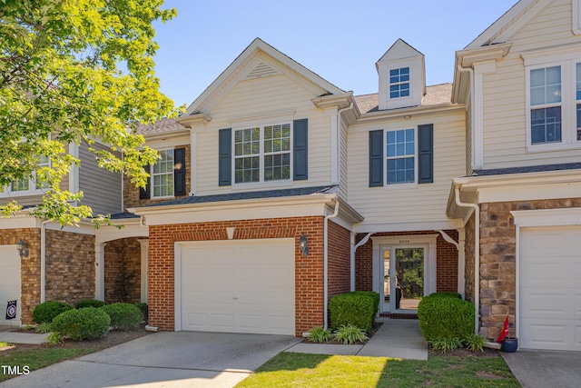 8404 Saltwood Pl, Raleigh, NC 27617 - view of property featuring a garage, driveway, brick siding, and a shingled roof