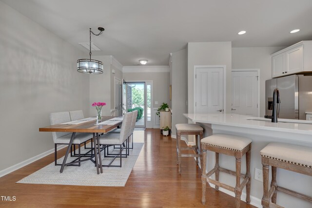 8404 Saltwood Pl, Raleigh, NC 27617 - dining room featuring baseboards, wood finished floors, and recessed lighting