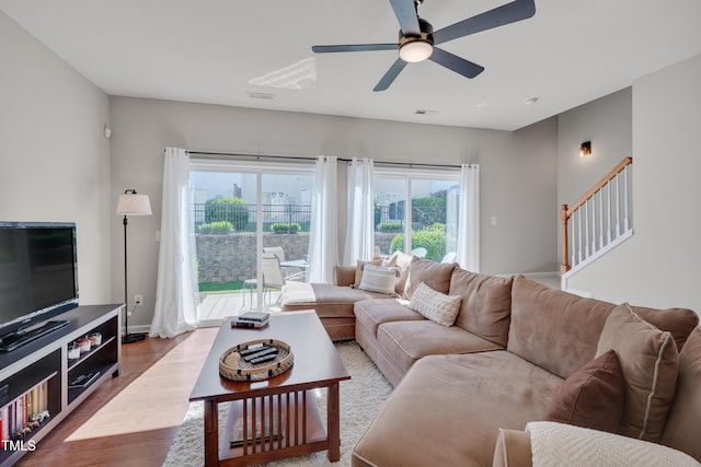 8404 Saltwood Pl, Raleigh, NC 27617 - living area with wood finished floors, a ceiling fan, and baseboards