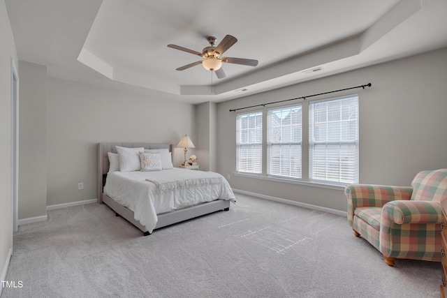 8404 Saltwood Pl, Raleigh, NC 27617 - bedroom with a raised ceiling, carpet, baseboards, and a ceiling fan