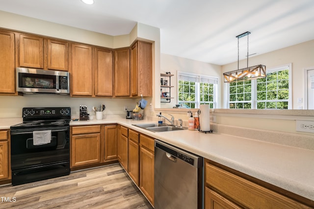 6 Beaver Creek Ln, Durham, NC 27703 - kitchen with stainless steel appliances, a sink, healthy amount of natural light, light countertops, and recessed lighting