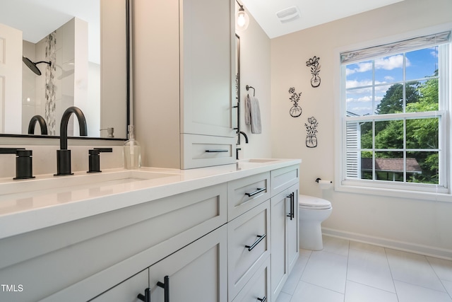 6 Beaver Creek Ln, Durham, NC 27703 - full bath with double vanity, toilet, baseboards, and plenty of natural light