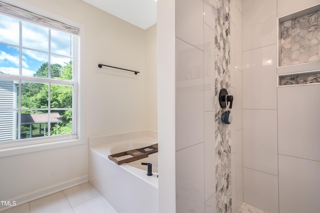 6 Beaver Creek Ln, Durham, NC 27703 - bathroom featuring a tile shower, a bath, tile patterned flooring, and baseboards