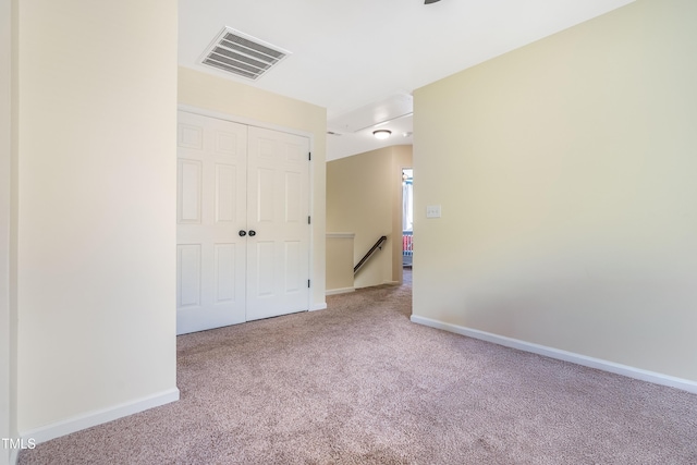6 Beaver Creek Ln, Durham, NC 27703 - unfurnished bedroom with carpet flooring, a closet, and baseboards