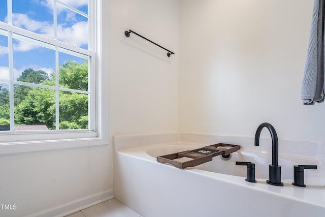 6 Beaver Creek Ln, Durham, NC 27703 - bathroom featuring a bath and tile patterned flooring