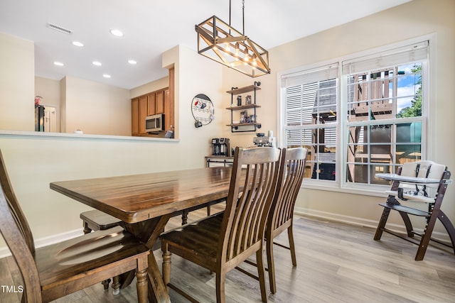 6 Beaver Creek Ln, Durham, NC 27703 - dining space with light wood-style flooring, baseboards, and recessed lighting