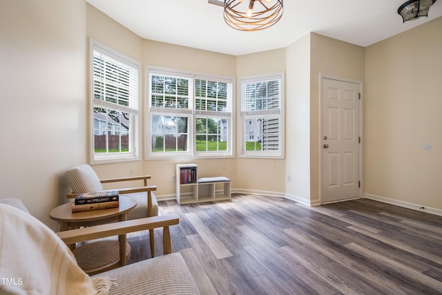 6 Beaver Creek Ln, Durham, NC 27703 - living area featuring wood finished floors, baseboards, and a chandelier