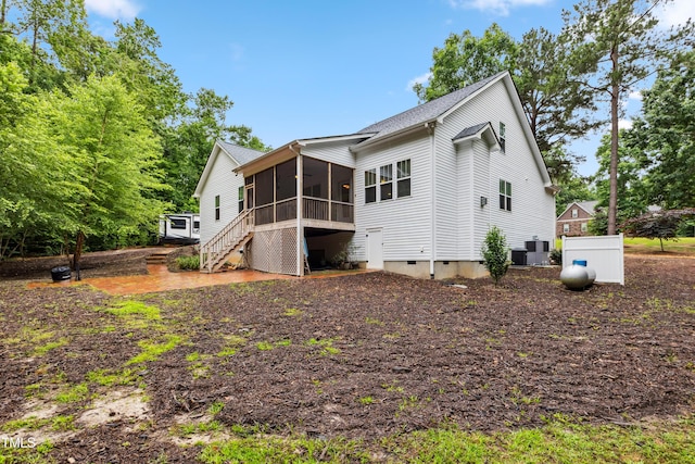 100 Lexington Ave, Zebulon, NC 27597 - back of property featuring a sunroom, stairway, and central AC unit