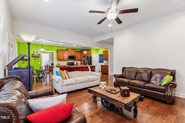 100 Lexington Ave, Zebulon, NC 27597 - living room with a ceiling fan, wood finished floors, crown molding, baseboards, and recessed lighting