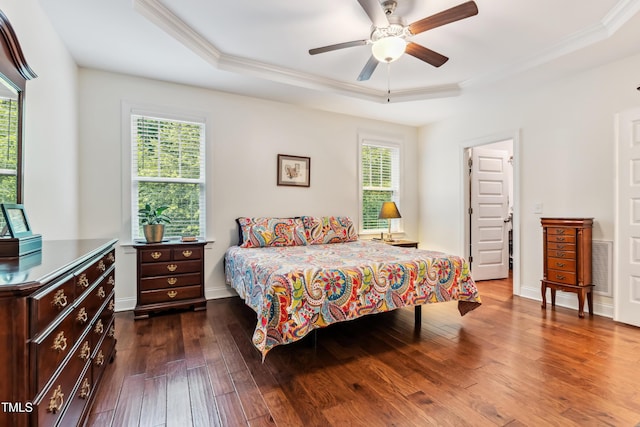 100 Lexington Ave, Zebulon, NC 27597 - bedroom featuring a tray ceiling, ornamental molding, dark wood-style flooring, baseboards, and a ceiling fan