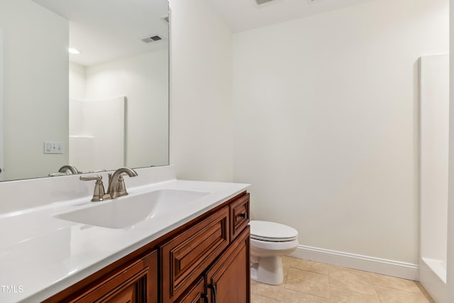 100 Lexington Ave, Zebulon, NC 27597 - full bath featuring toilet, vanity, tile patterned flooring, and baseboards