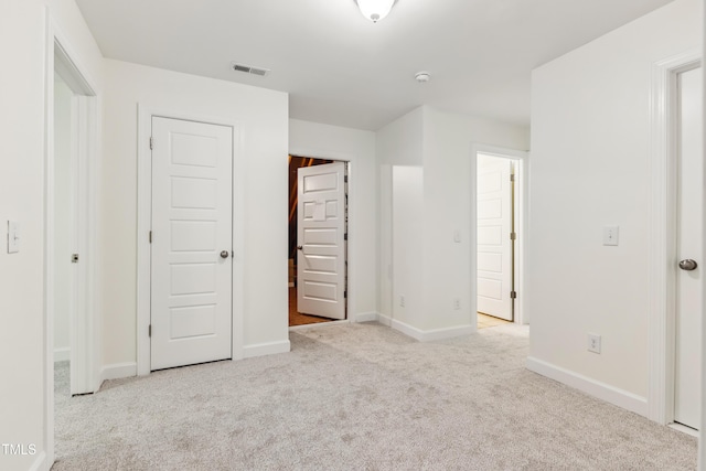 100 Lexington Ave, Zebulon, NC 27597 - unfurnished bedroom with carpet floors and baseboards