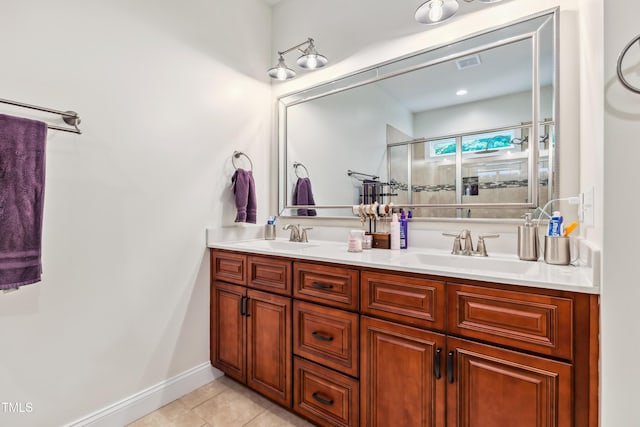 100 Lexington Ave, Zebulon, NC 27597 - bathroom featuring double vanity, a shower stall, and tile patterned flooring