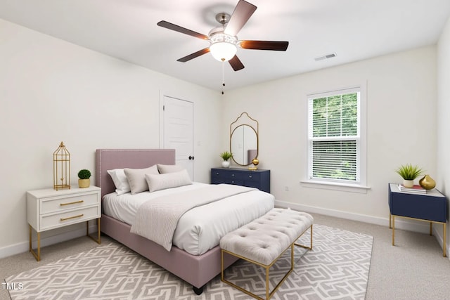 100 Lexington Ave, Zebulon, NC 27597 - bedroom with light carpet, baseboards, and ceiling fan
