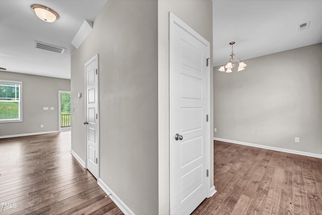 173 Forsyth Pkwy, Clayton, NC 27520 - corridor featuring wood finished floors, a chandelier, and baseboards