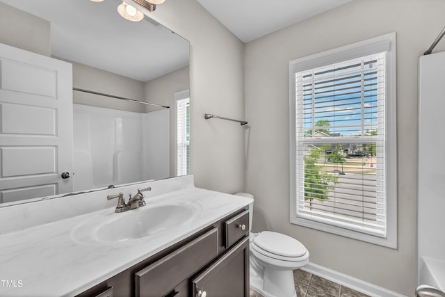 173 Forsyth Pkwy, Clayton, NC 27520 - full bathroom with a shower, vanity, baseboards, toilet, and tile patterned floors