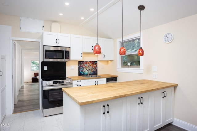 126 Barclay Rd, Chapel Hill, NC 27516 - kitchen with wood counters, stainless steel microwave, wall oven, a sink, and a peninsula