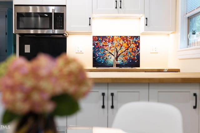 126 Barclay Rd, Chapel Hill, NC 27516 - kitchen with stainless steel microwave and white cabinetry
