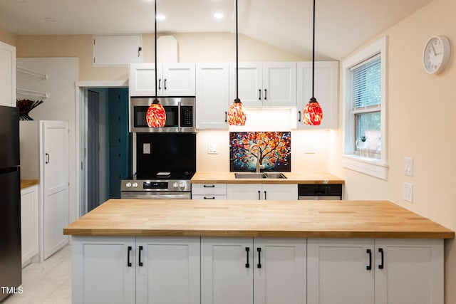 126 Barclay Rd, Chapel Hill, NC 27516 - kitchen featuring wooden counters, stainless steel microwave, a sink, oven, and white cabinets