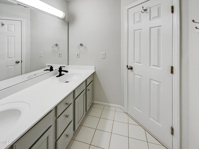105 Crosswaite Way, Cary, NC 27518 - bathroom with double vanity, tile patterned flooring, and baseboards